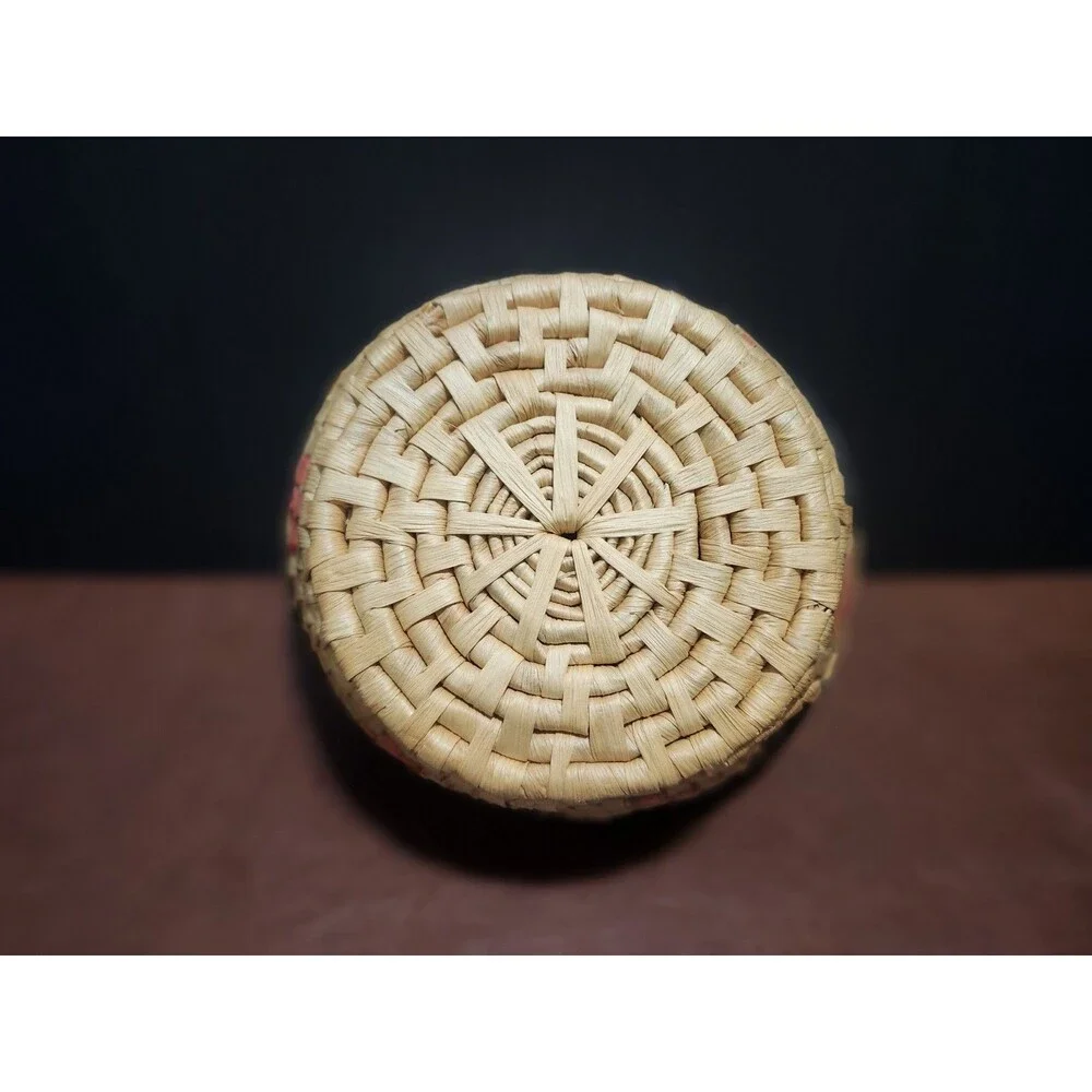 This handmade, round basket resembles those traditionally crafted by artisans.